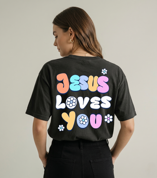Back of black Jesus Loves You t-shirt with vibrant colorful floral bubble letter design - Faith & Co