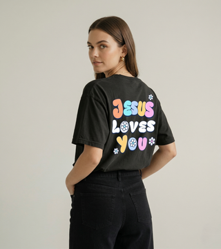 Angled back view of black Jesus Loves You Christian tee with colorful graphic design - Faith & Co