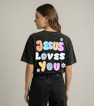 Back view of black "Jesus Loves You" Christian graphic tee showing full bold colorful retro JESUS LOVES YOU text with flowers design — Faith & Co.