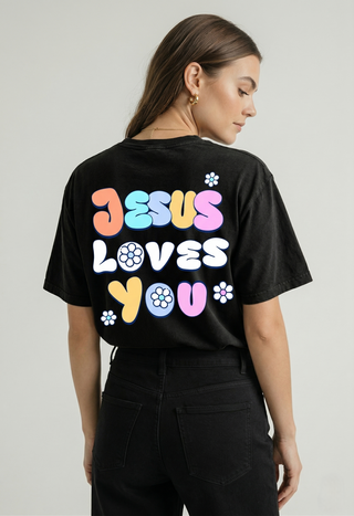 Back view of black "Jesus Loves You" Christian graphic tee showing colorful retro floral bubble letter design JESUS LOVES YOU with daisy accents