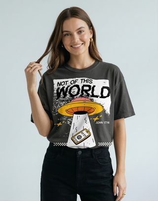 Close-up of "Not of This World" UFO graphic design on charcoal Christian t-shirt, John 17:16 bible verse tee